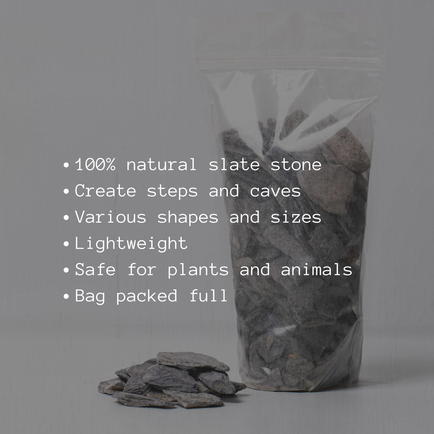 Stack of dark grey slate stones, ideal for creating layered landscapes in aquascaping or minimalist plant displays.