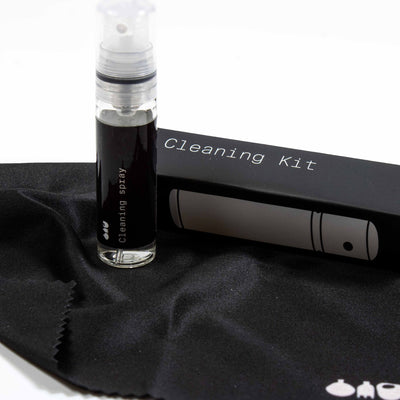 Handheld cleaning kit with microfiber cloth and refillable mini spray bottle, tailored for gentle and thorough terrarium upkeep.