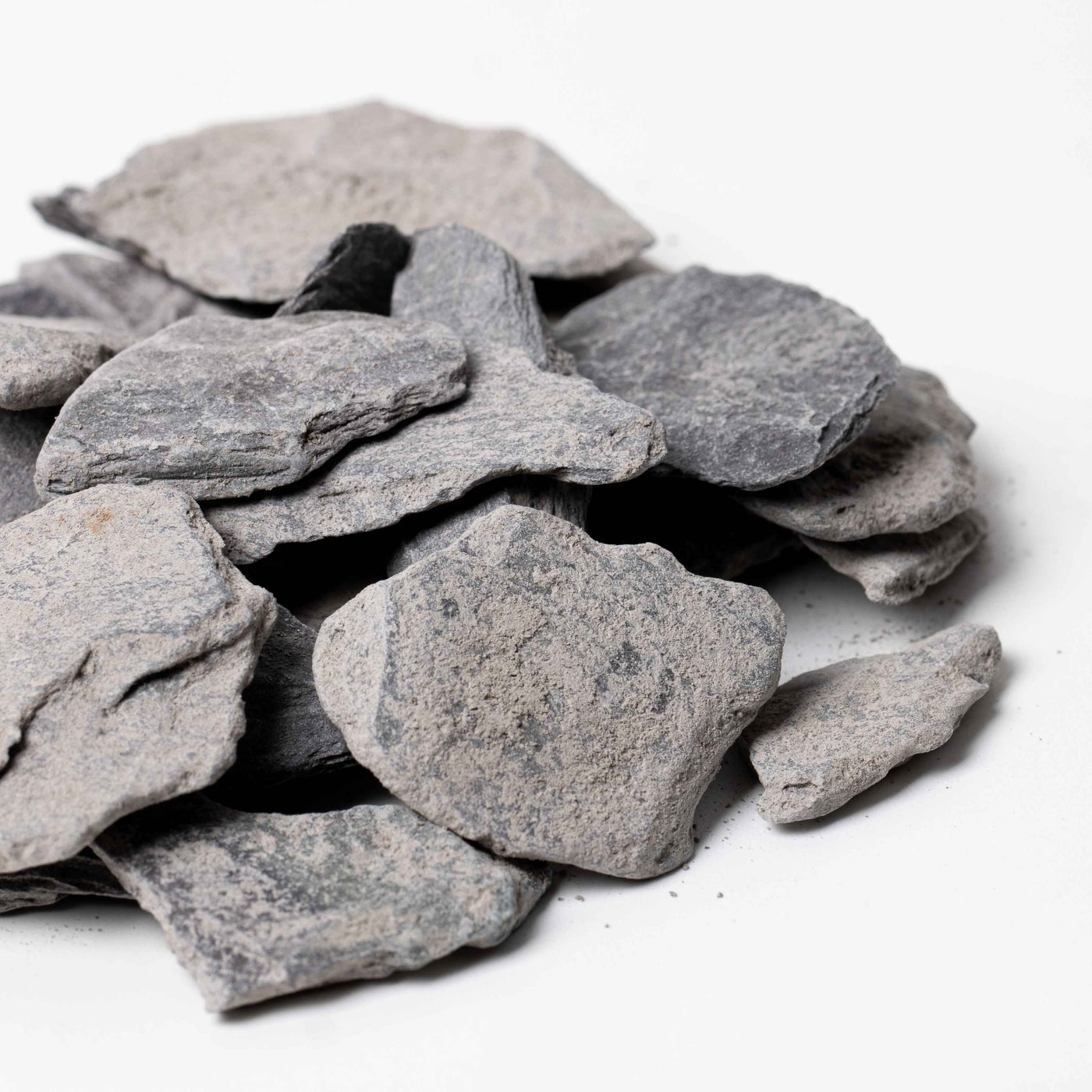 Natural slate stone pieces, perfect for terrariums and aquariums, offering a flat, textured surface for decorative or structural use.