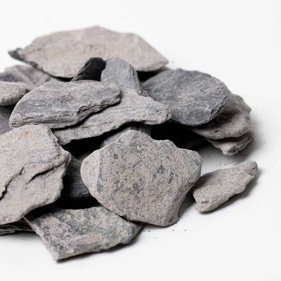Natural slate stone pieces, perfect for terrariums and aquariums, offering a flat, textured surface for decorative or structural use.